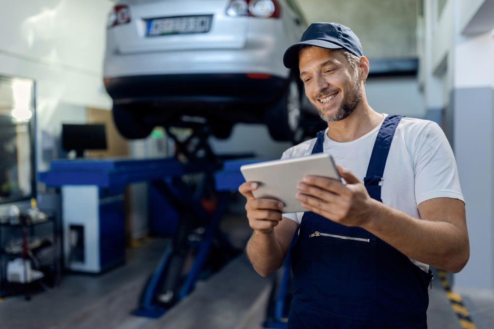 Man doing field service management software on a tablet device