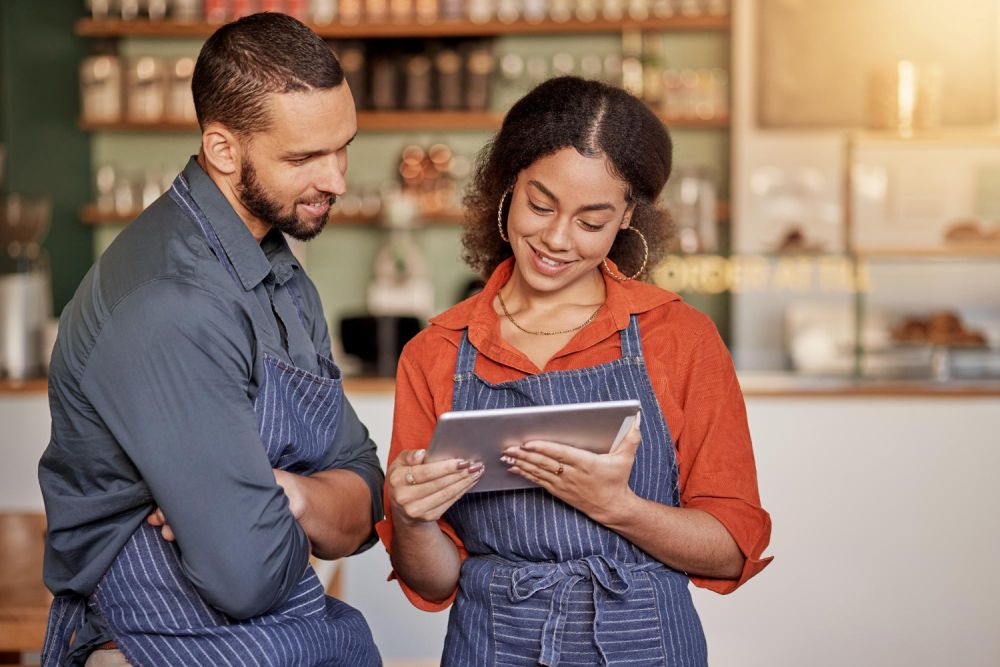 Man and woman using point of sale software