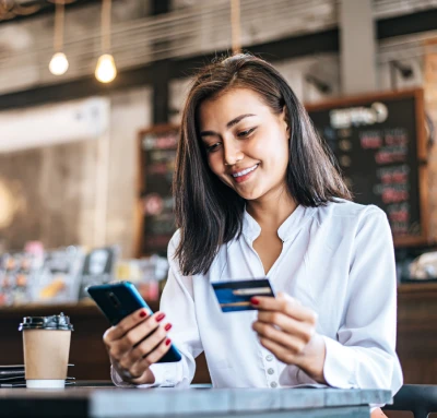 Woman paying an invoice through an emailed link